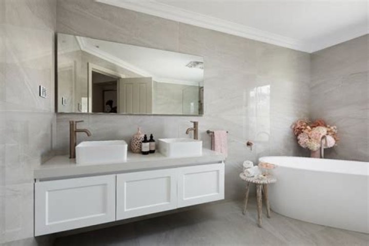 Can I tile over tiles in bathroom