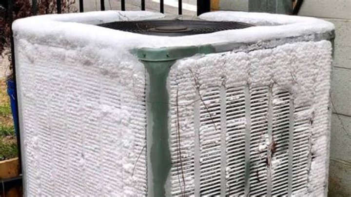 How do I keep snow off my heat pump