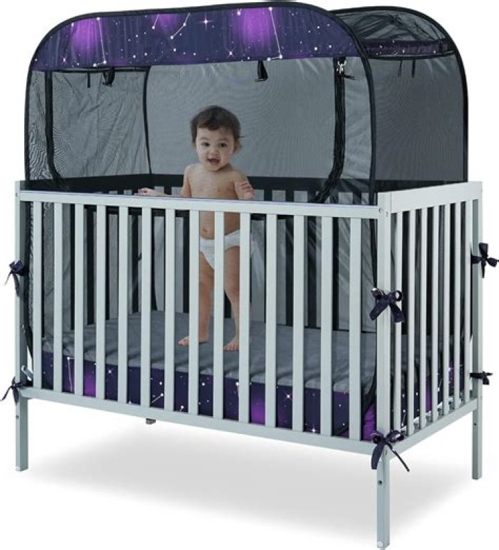 How do I stop my baby from climbing out of the cot?