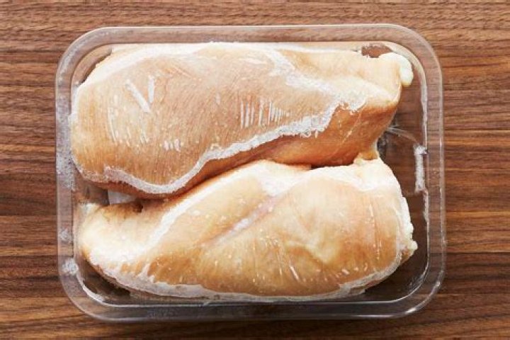 Is it safe to defrost frozen chicken in the microwave?