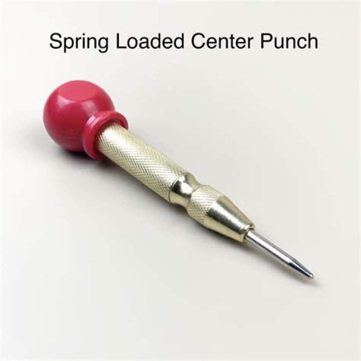 What is a spring loaded center punch used for?