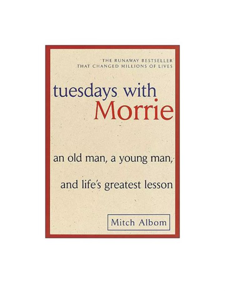 Why does Morrie say most people are unhappy?